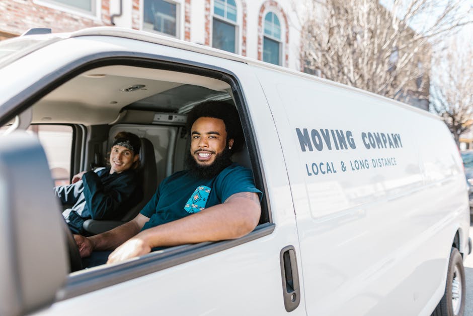 Professional movers team carefully handling furniture