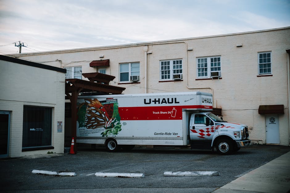 Movers loading boxes onto a large moving truck